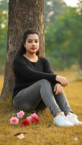 Ultra-realistic outdoor portrait of my original face, sitting on grass against a tree.